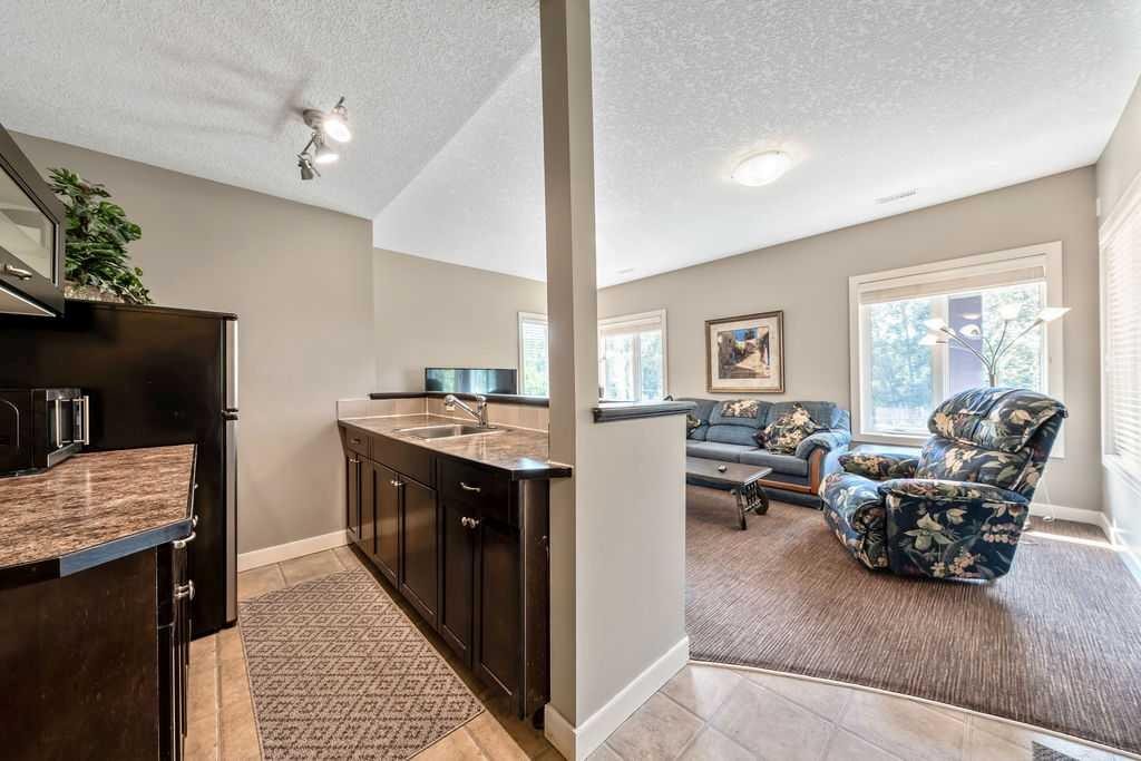 259 Willow Ridge Manor, Diamond Valley, AB - Indoor Photo Showing Kitchen With Double Sink