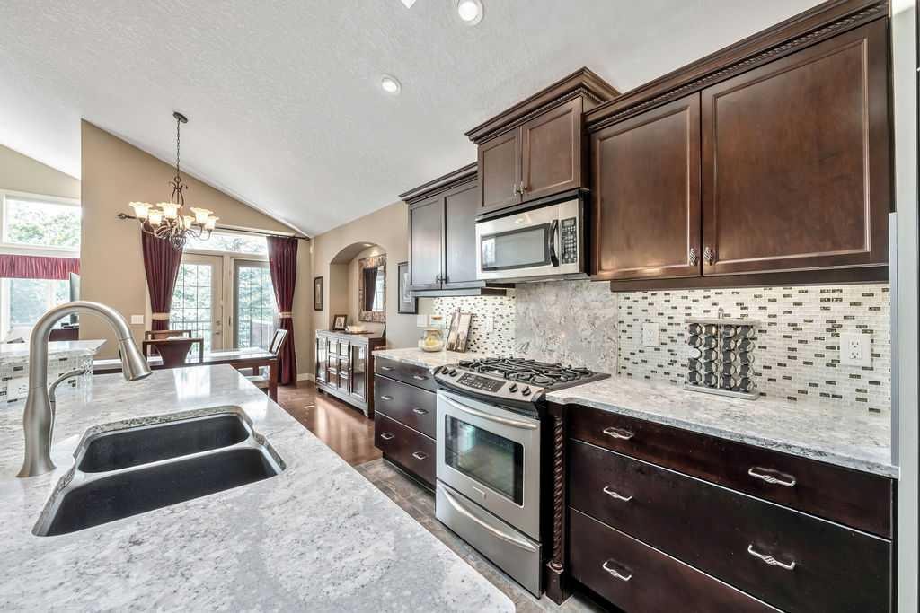 259 Willow Ridge Manor, Diamond Valley, AB - Indoor Photo Showing Kitchen With Double Sink With Upgraded Kitchen