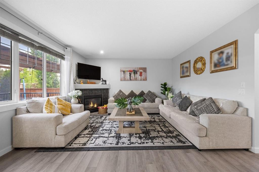 575 Evergreen Circle Sw, Calgary, AB - Indoor Photo Showing Living Room With Fireplace