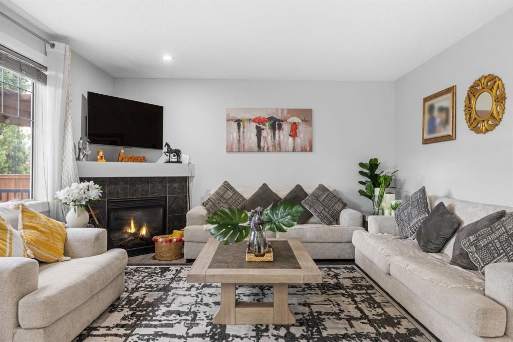 575 Evergreen Circle Sw, Calgary, AB - Indoor Photo Showing Living Room With Fireplace
