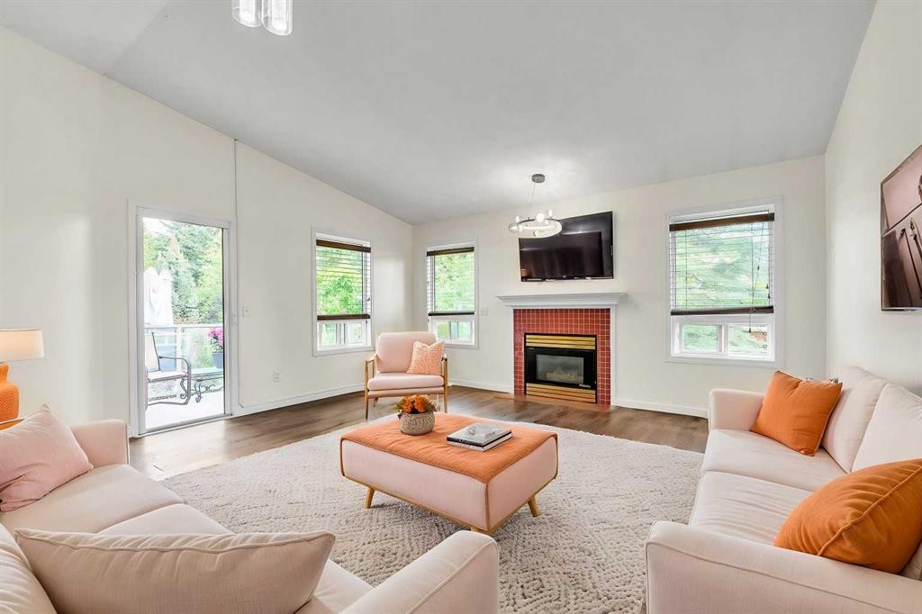 68 Catalina Circle Ne, Calgary, AB - Indoor Photo Showing Living Room With Fireplace