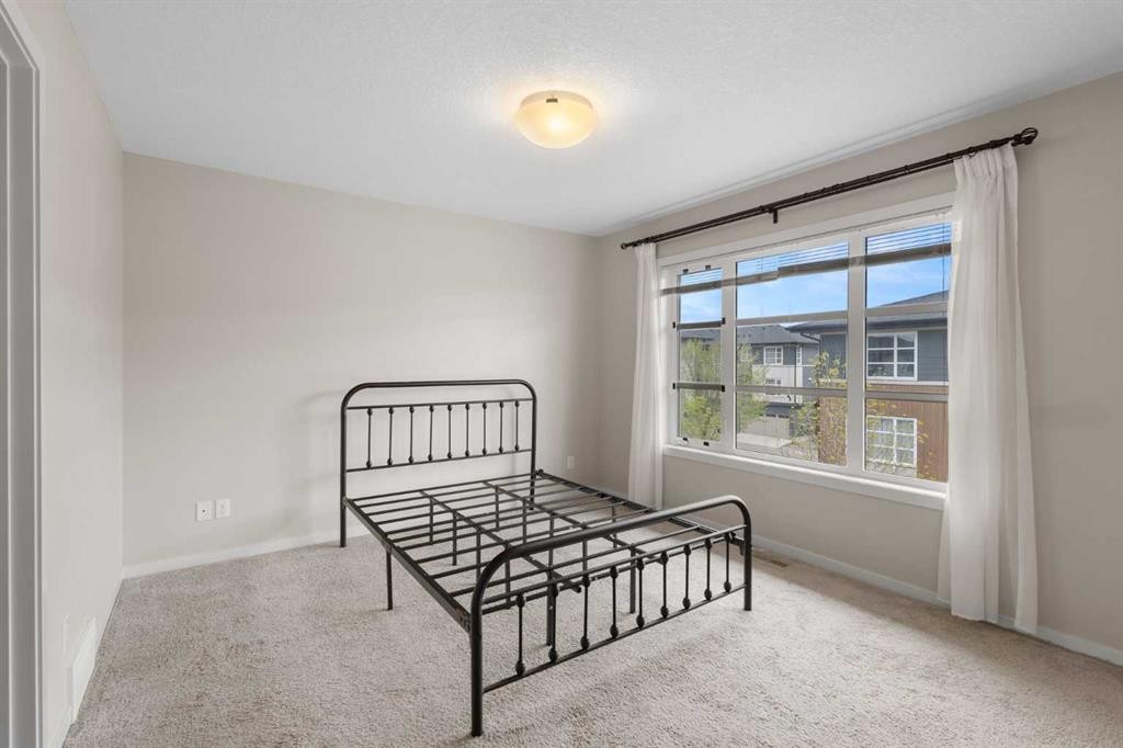 506 Evansridge Park Nw, Calgary, AB - Indoor Photo Showing Bedroom