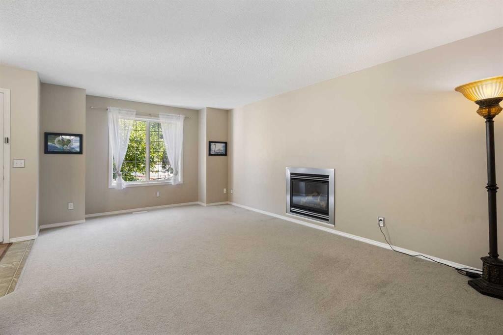 49 Evermeadow Manor Sw, Calgary, AB - Indoor With Fireplace