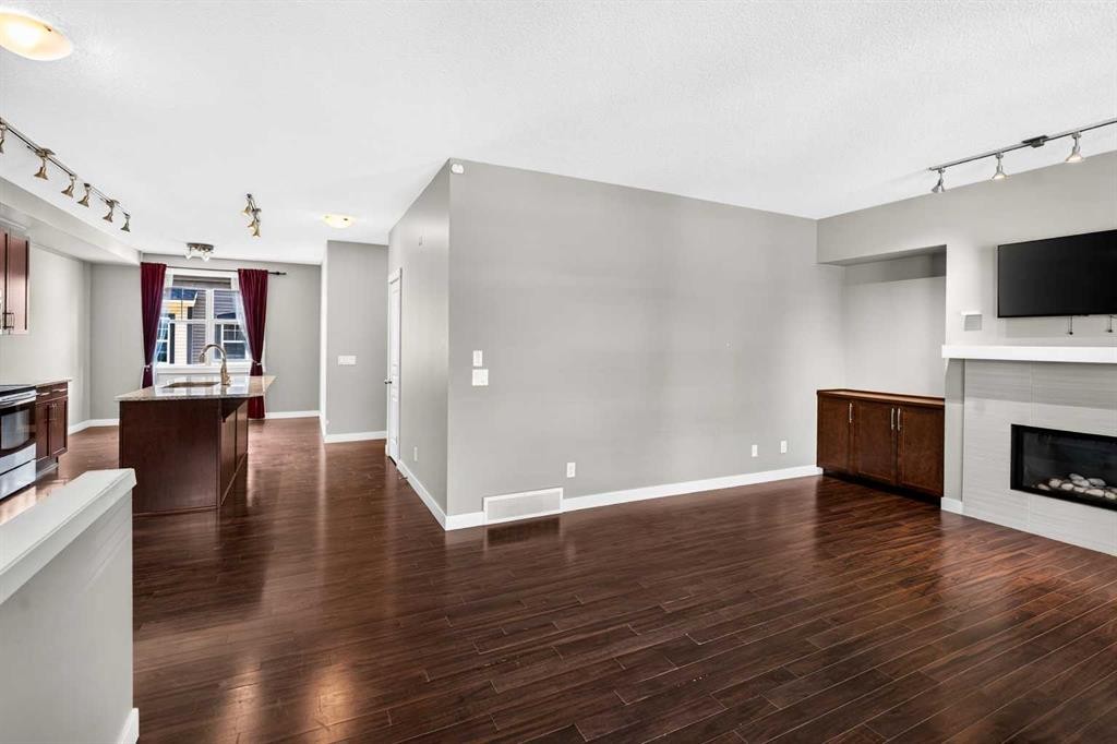 235 Mckenzie Towne Link Se, Calgary, AB - Indoor Photo Showing Living Room With Fireplace