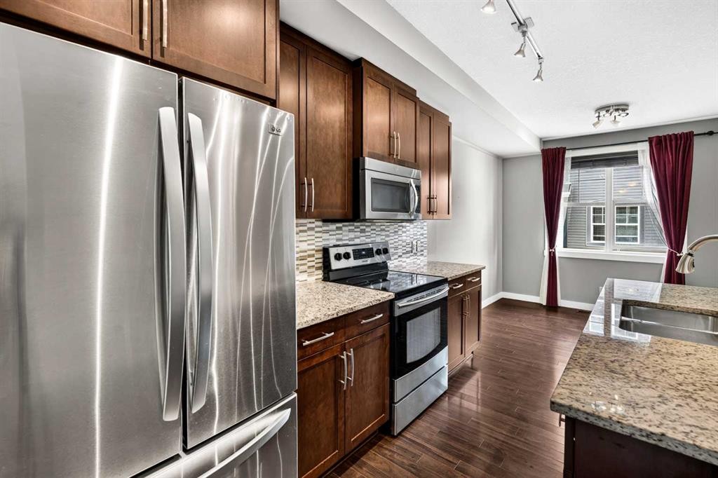 235 Mckenzie Towne Link Se, Calgary, AB - Indoor Photo Showing Kitchen With Double Sink With Upgraded Kitchen