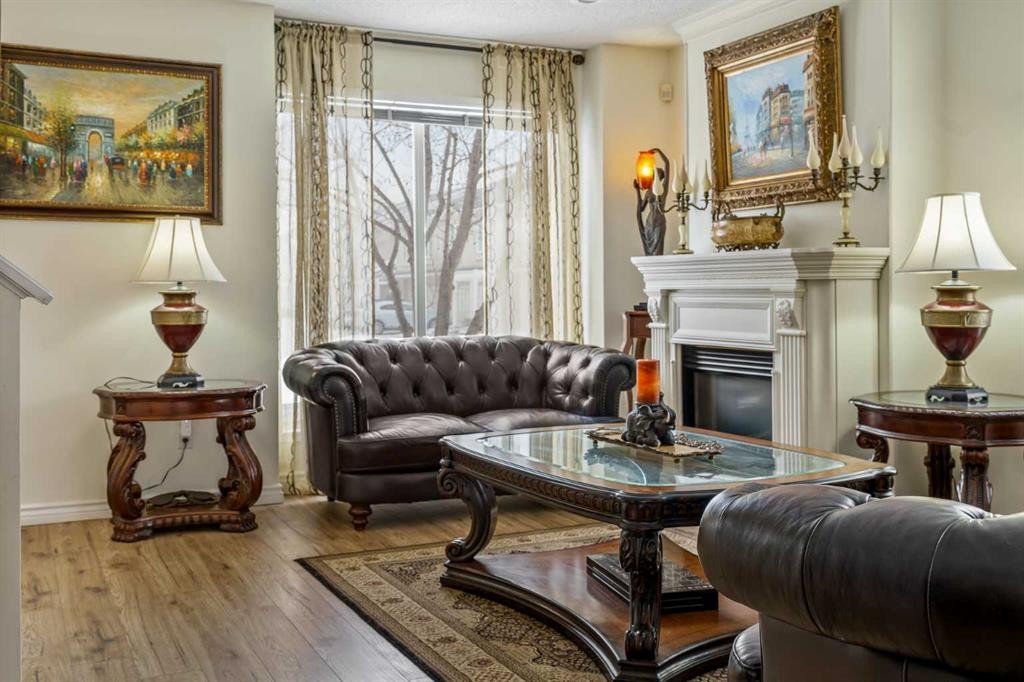 76 Sunlake Gardens Se, Calgary, AB - Indoor Photo Showing Living Room With Fireplace