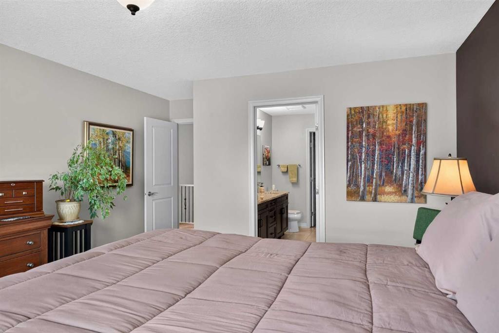172 Riviera Way, Cochrane, AB - Indoor Photo Showing Bedroom
