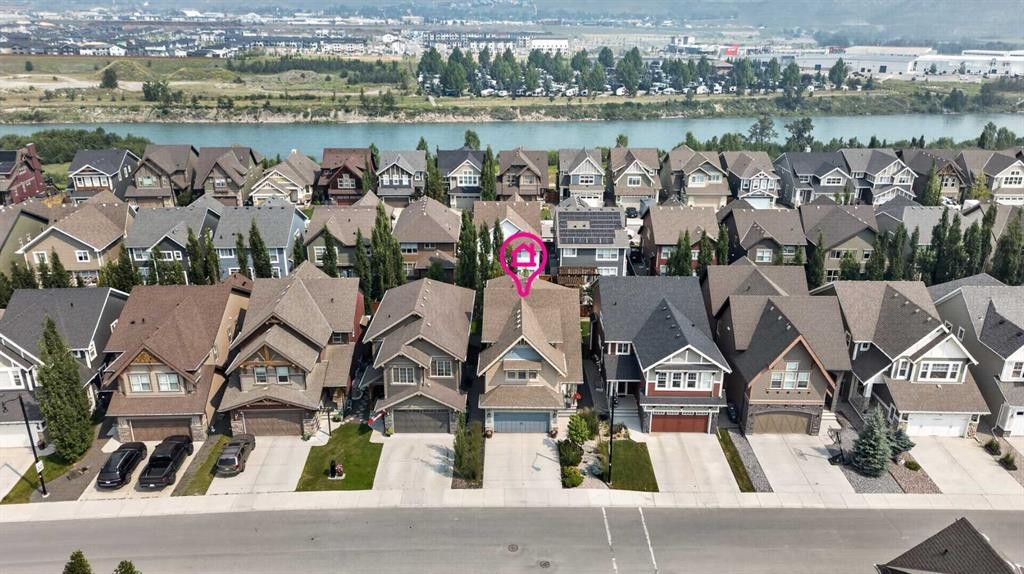 172 Riviera Way, Cochrane, AB - Outdoor With Body Of Water With Facade