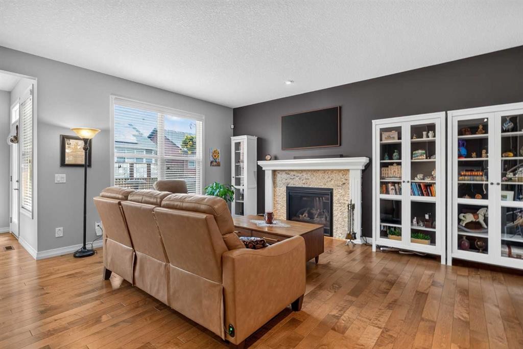 172 Riviera Way, Cochrane, AB - Indoor Photo Showing Living Room With Fireplace