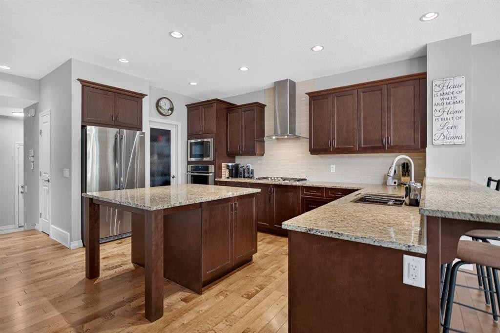 172 Riviera Way, Cochrane, AB - Indoor Photo Showing Kitchen With Upgraded Kitchen