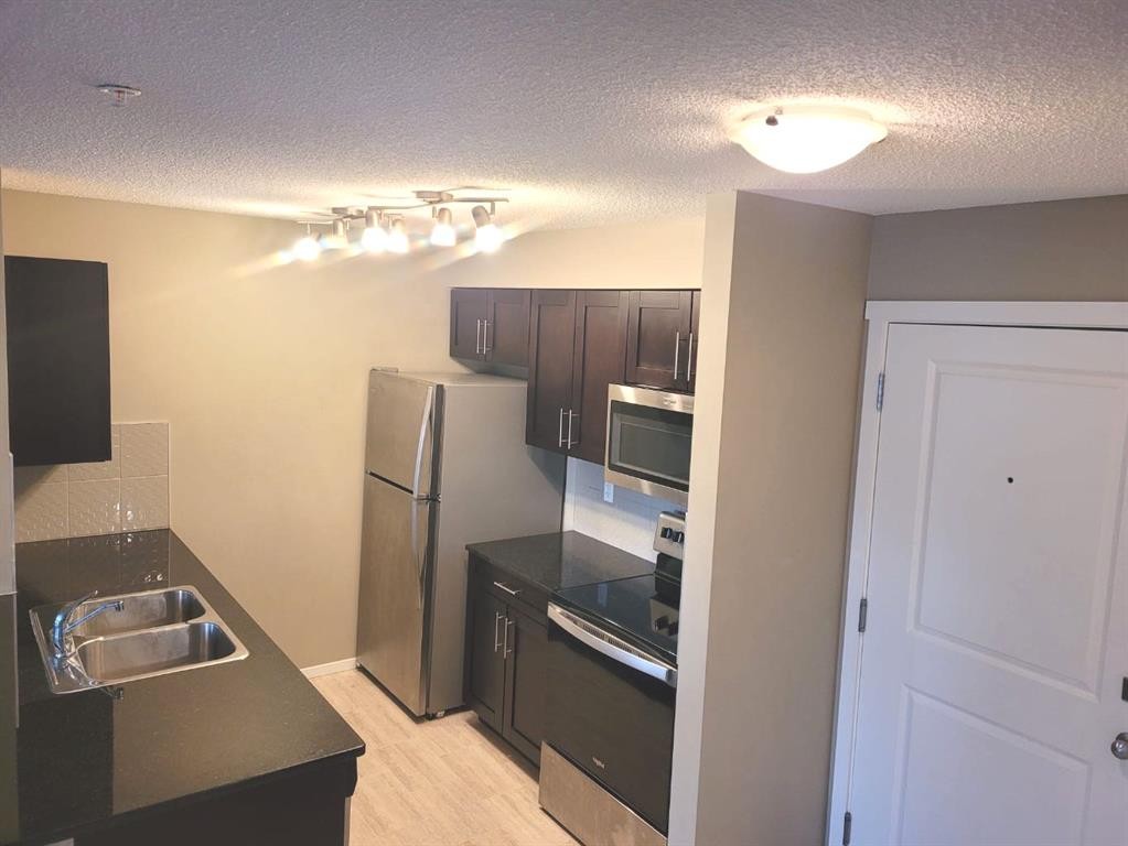 2238-81 Legacy Boulevard Se, Calgary, AB - Indoor Photo Showing Kitchen With Double Sink