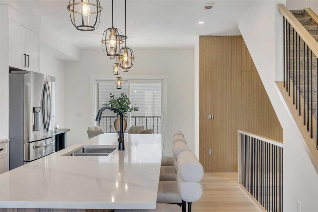 203-8850 48 Street Ne, Calgary, AB - Indoor Photo Showing Kitchen With Double Sink