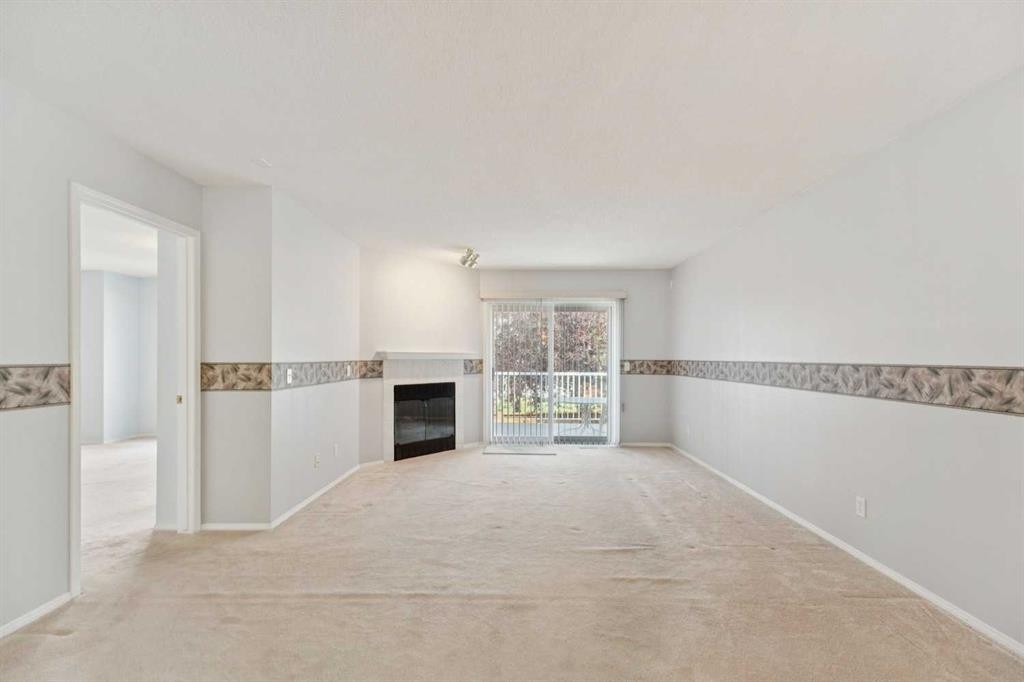 134 Hawkstone Manor Nw, Calgary, AB - Indoor With Fireplace