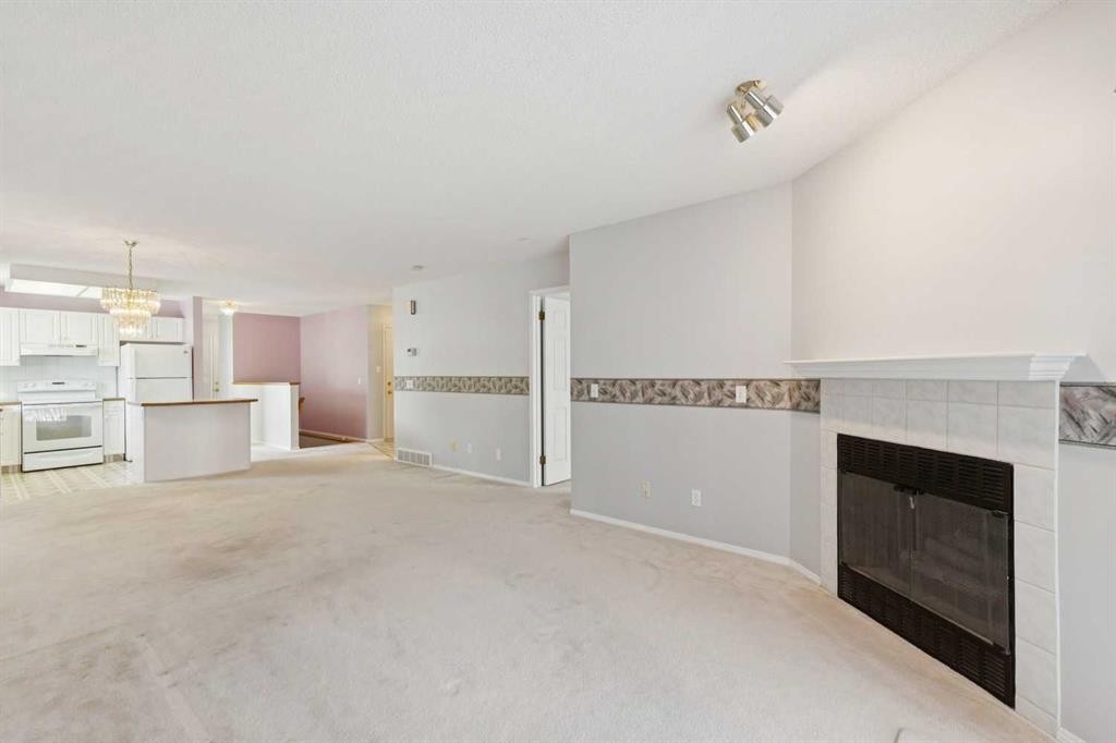 134 Hawkstone Manor Nw, Calgary, AB - Indoor With Fireplace