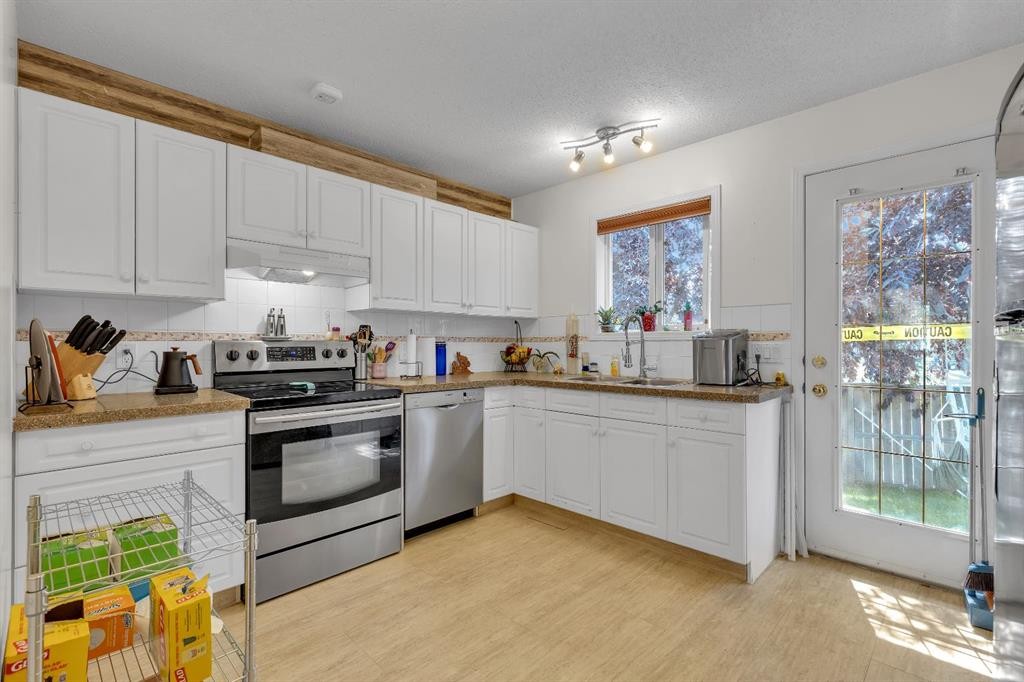 36 Dovista Court Se, Calgary, AB - Indoor Photo Showing Kitchen With Double Sink