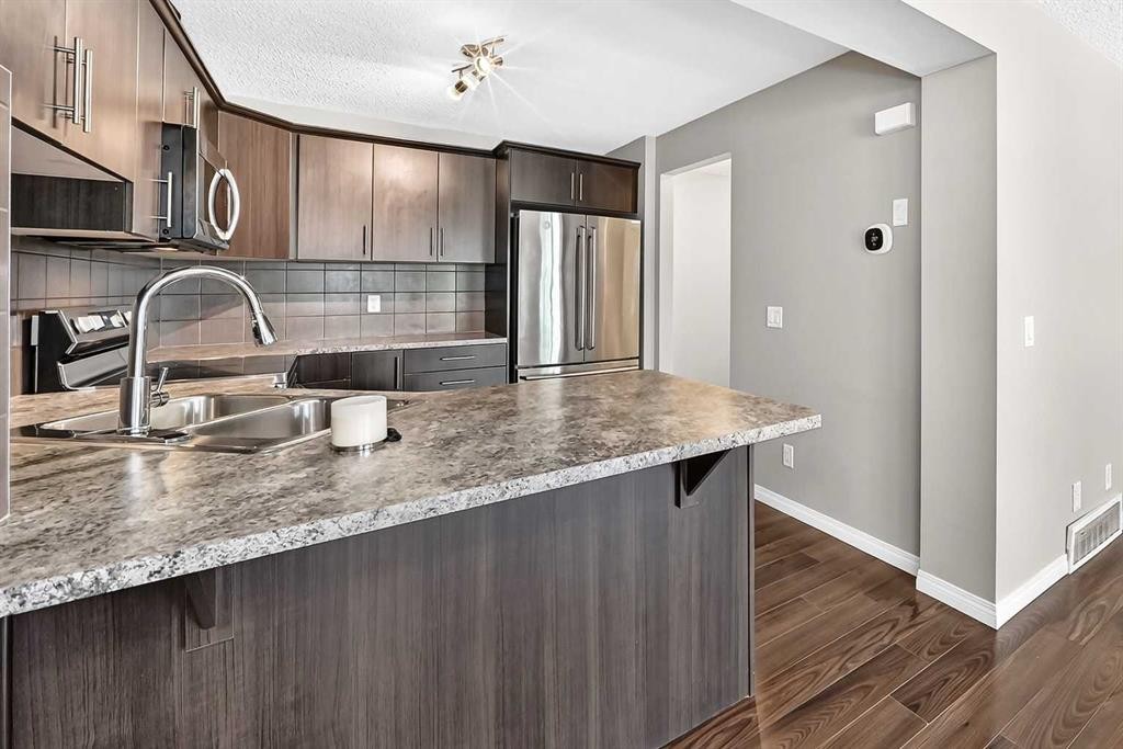 12 Cityscape Row Ne, Calgary, AB - Indoor Photo Showing Kitchen With Double Sink With Upgraded Kitchen
