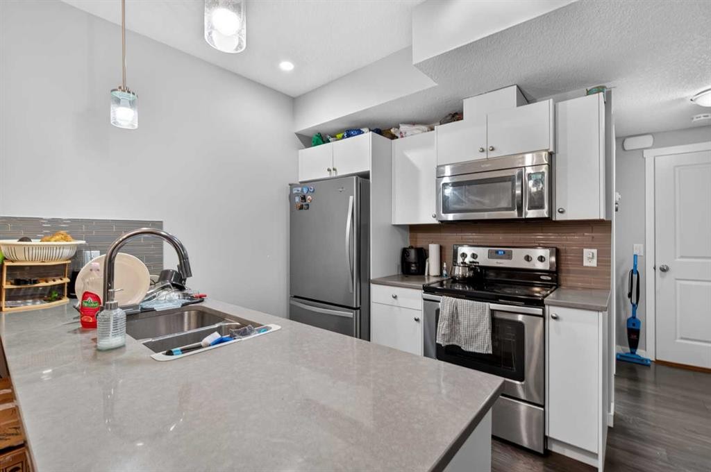 45 Saddlestone Drive Ne, Calgary, AB - Indoor Photo Showing Kitchen With Stainless Steel Kitchen With Double Sink With Upgraded Kitchen