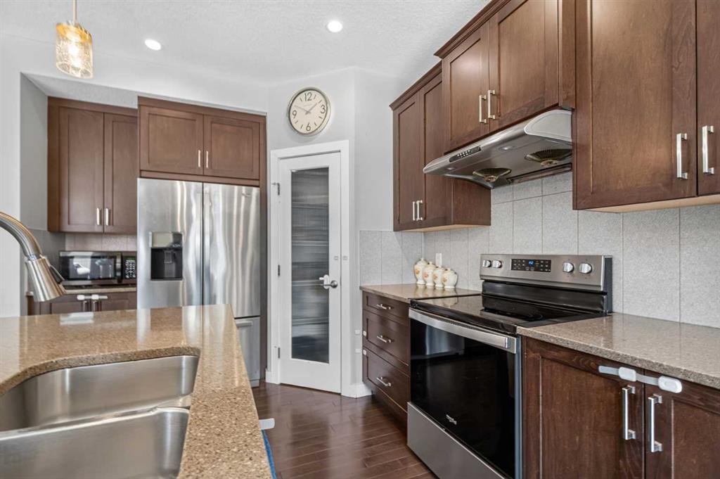45 Saddlestone Drive Ne, Calgary, AB - Indoor Photo Showing Kitchen With Stainless Steel Kitchen With Double Sink With Upgraded Kitchen