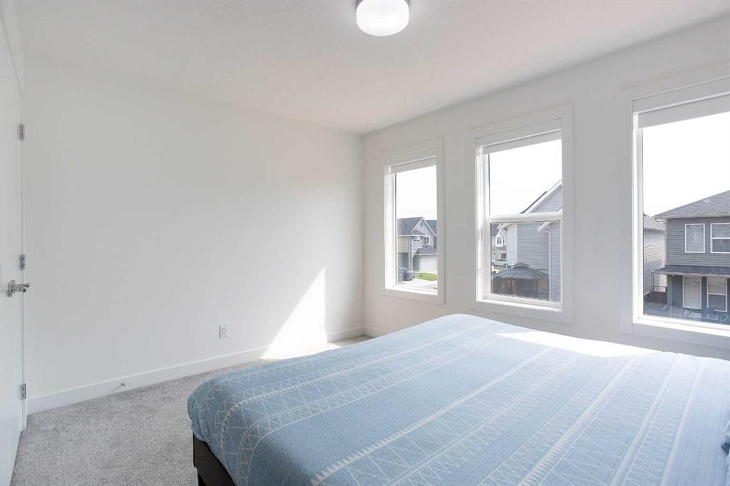 91 Copperhead Grove Se, Calgary, AB - Indoor Photo Showing Bedroom