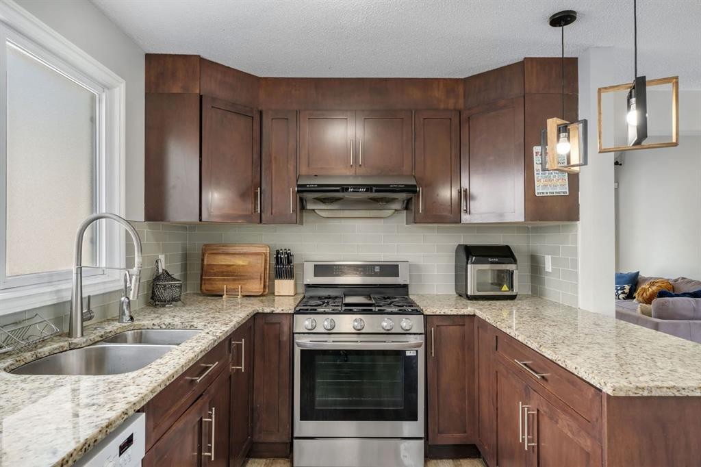 44 Strathclair Rise Sw, Calgary, AB - Indoor Photo Showing Kitchen With Stainless Steel Kitchen With Double Sink With Upgraded Kitchen