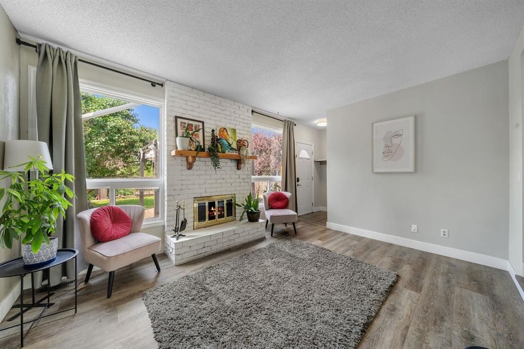 44 Strathclair Rise Sw, Calgary, AB - Indoor Photo Showing Living Room With Fireplace