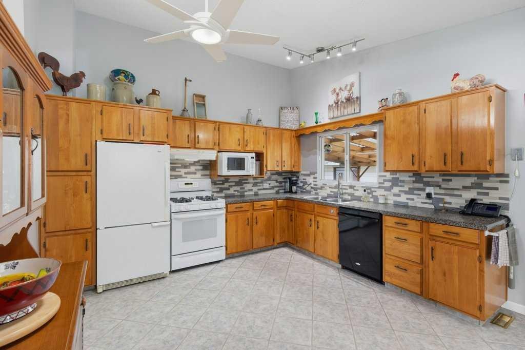 9511 Academy Drive Se, Calgary, AB - Indoor Photo Showing Kitchen With Double Sink