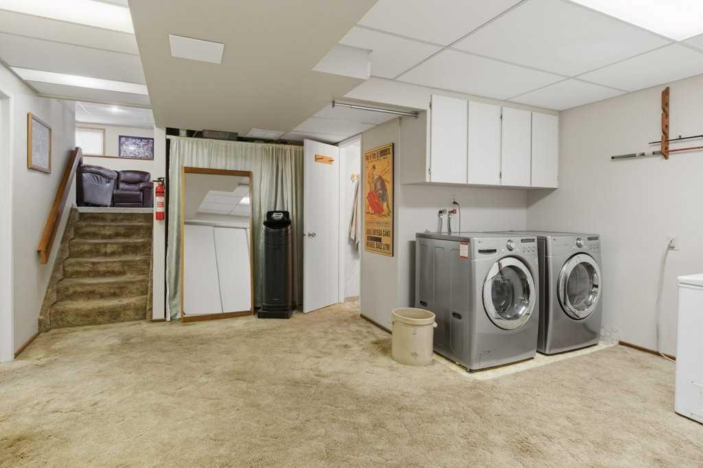 9511 Academy Drive Se, Calgary, AB - Indoor Photo Showing Laundry Room