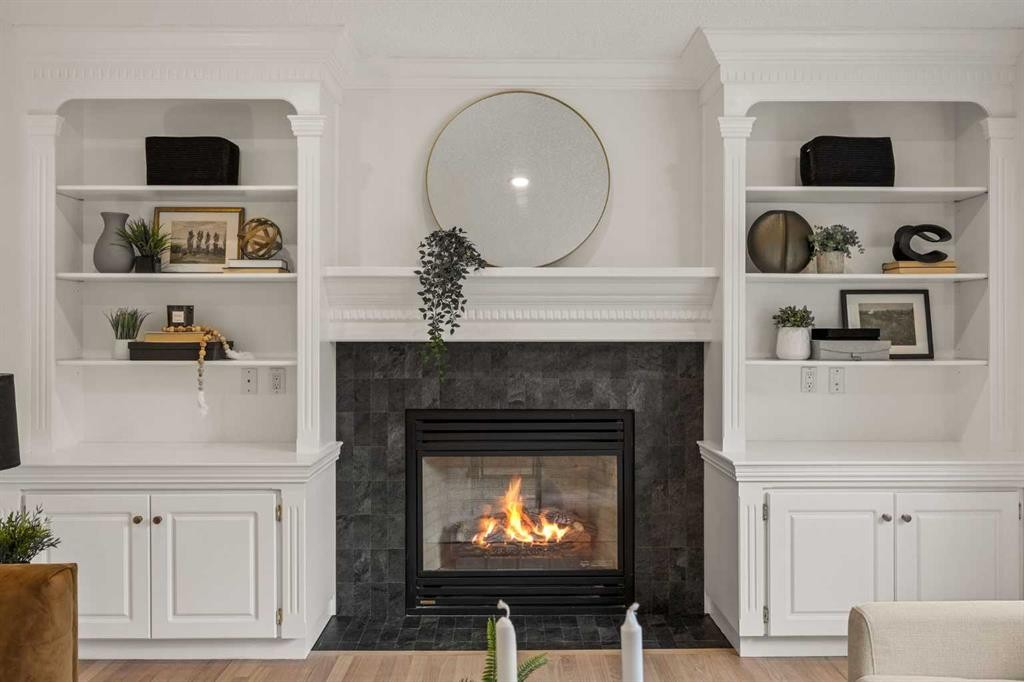 156 Strathridge Place Sw, Calgary, AB - Indoor Photo Showing Living Room With Fireplace