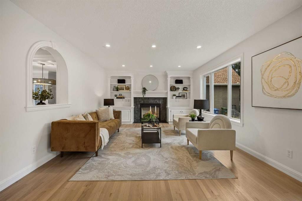 156 Strathridge Place Sw, Calgary, AB - Indoor Photo Showing Living Room With Fireplace