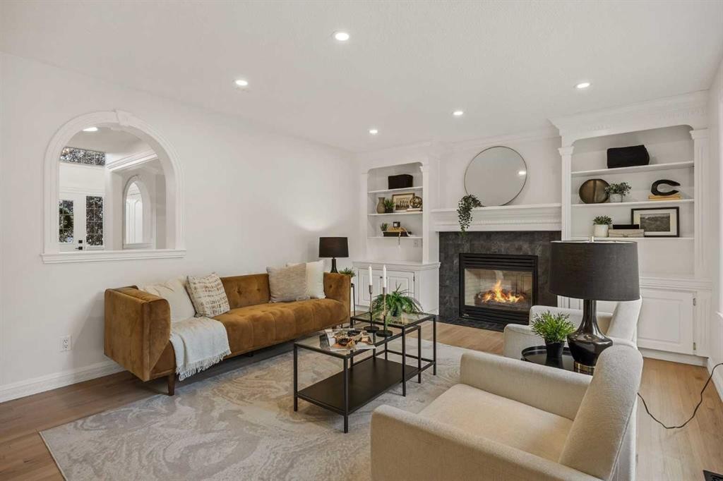 156 Strathridge Place Sw, Calgary, AB - Indoor Photo Showing Living Room With Fireplace