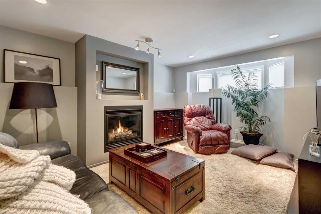 158 Somerset Close Sw, Calgary, AB - Indoor Photo Showing Living Room With Fireplace