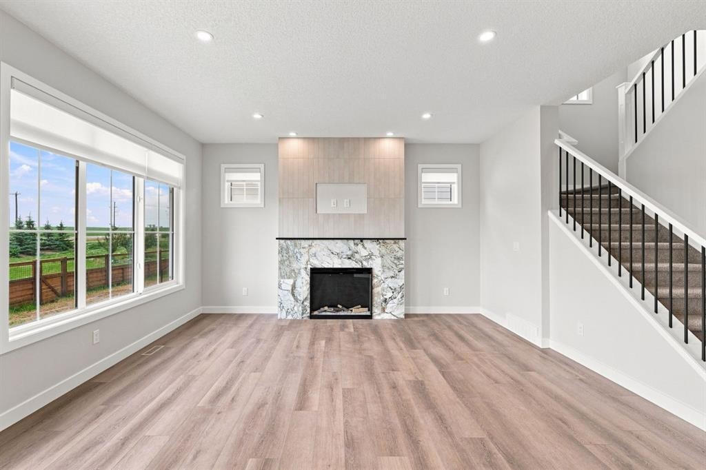 40 Fieldstone Close, Balzac, AB - Indoor Photo Showing Living Room With Fireplace
