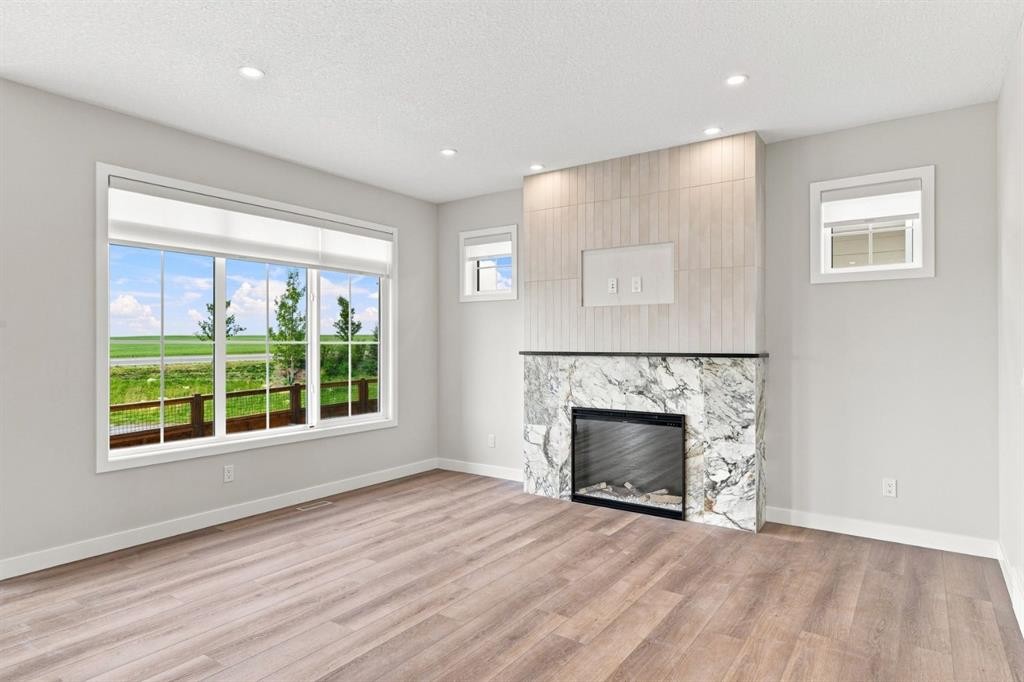40 Fieldstone Close, Balzac, AB - Indoor Photo Showing Living Room With Fireplace