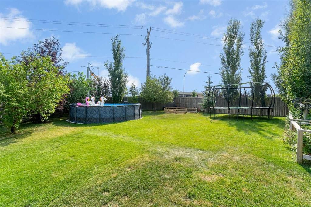 134 Channelside Cove Sw, Airdrie, AB - Outdoor With Backyard