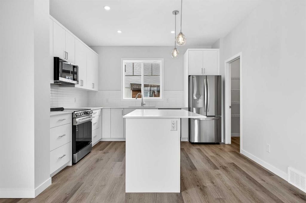 1027-132 Red Embers Link Ne, Calgary, AB - Indoor Photo Showing Kitchen With Stainless Steel Kitchen With Upgraded Kitchen