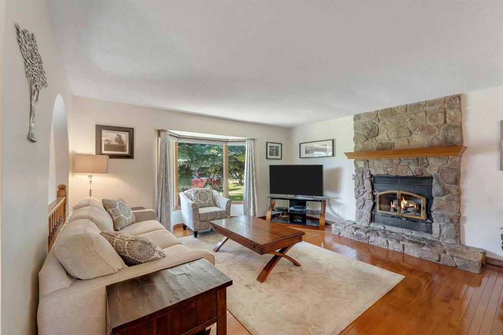 36 Mckerrell Court Se, Calgary, AB - Indoor Photo Showing Living Room With Fireplace