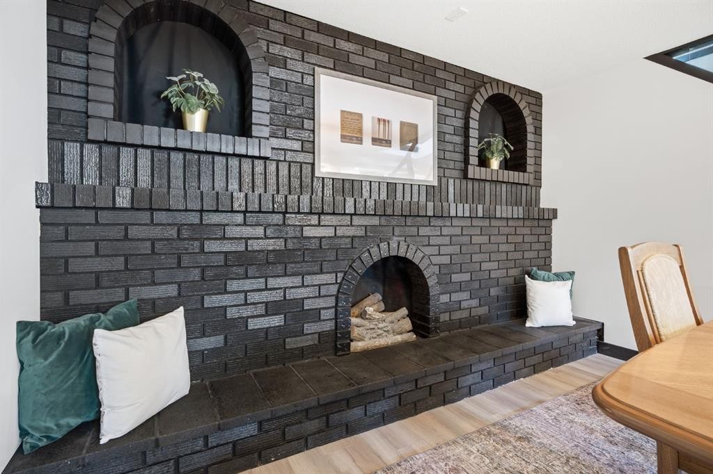 180 Huntford Road Ne, Calgary, AB - Indoor With Fireplace