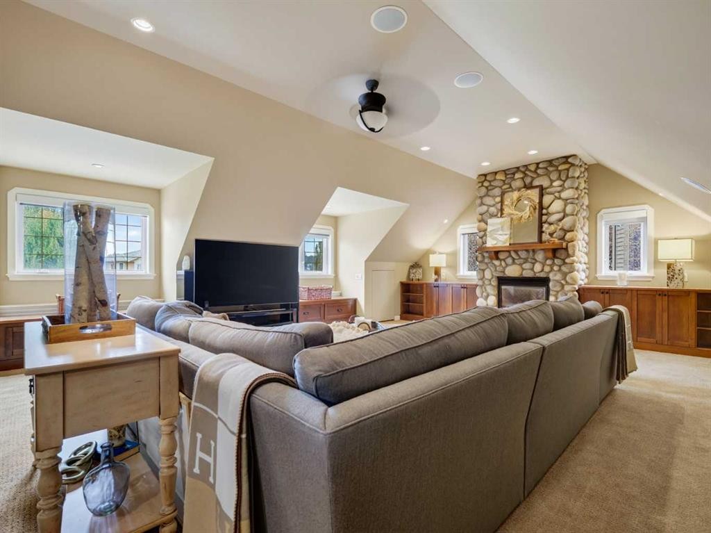 126 West Terrace Point, Cochrane, AB - Indoor Photo Showing Living Room With Fireplace