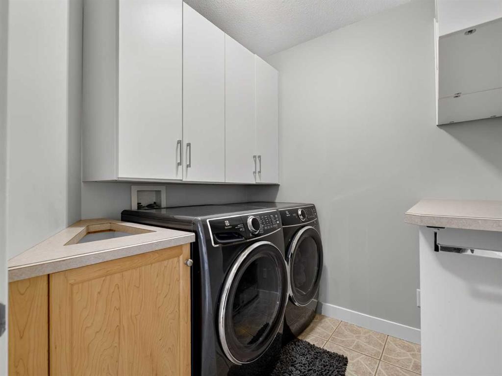 126 West Terrace Point, Cochrane, AB - Indoor Photo Showing Laundry Room
