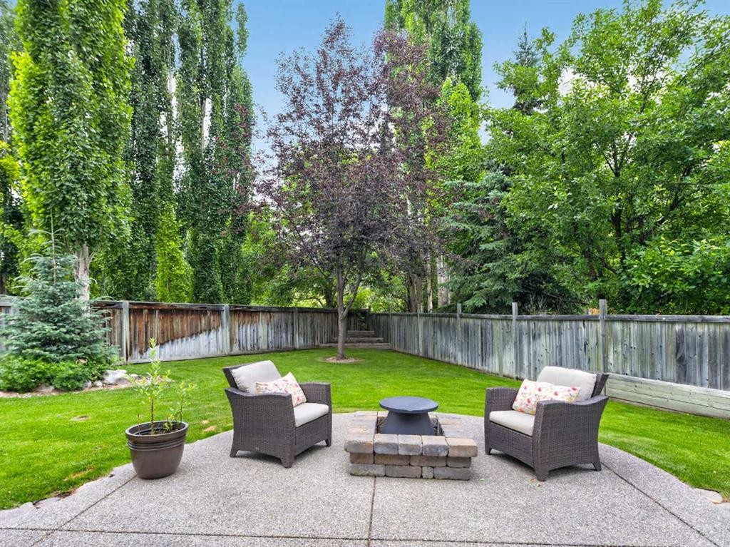 126 West Terrace Point, Cochrane, AB - Outdoor With Backyard
