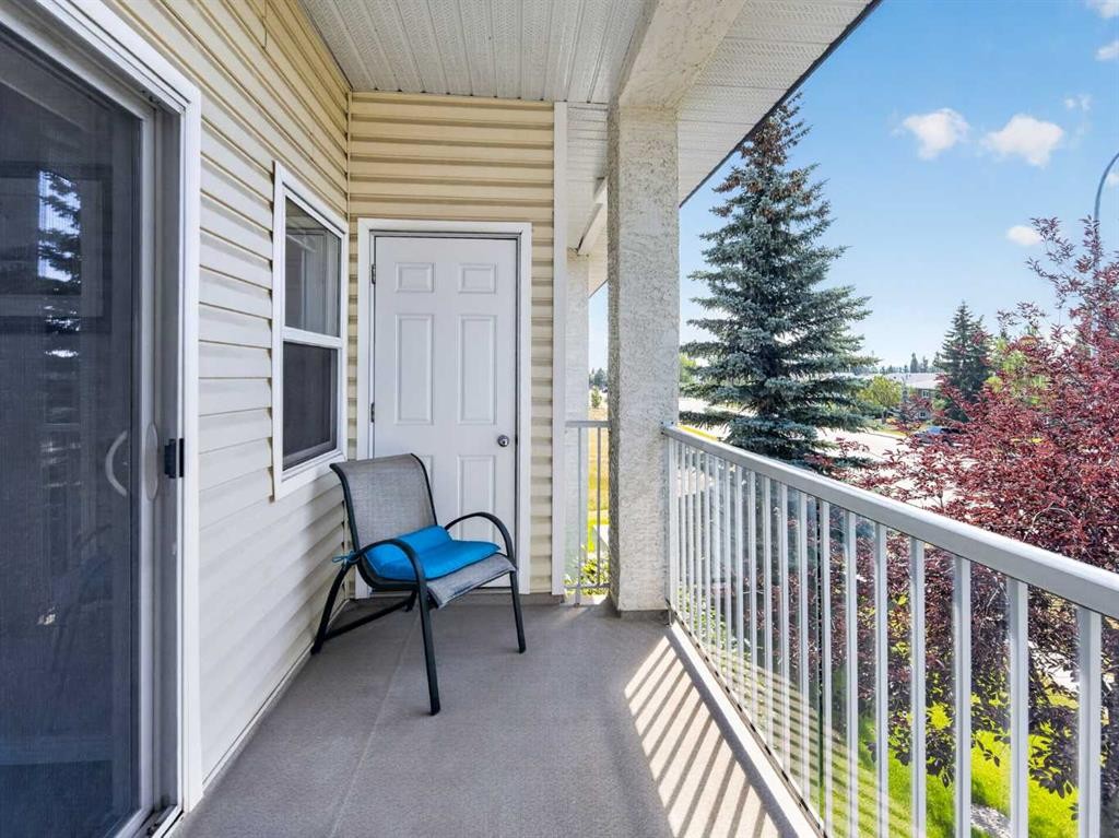 201-72 Quigley Drive, Cochrane, AB - Outdoor With Balcony With Exterior