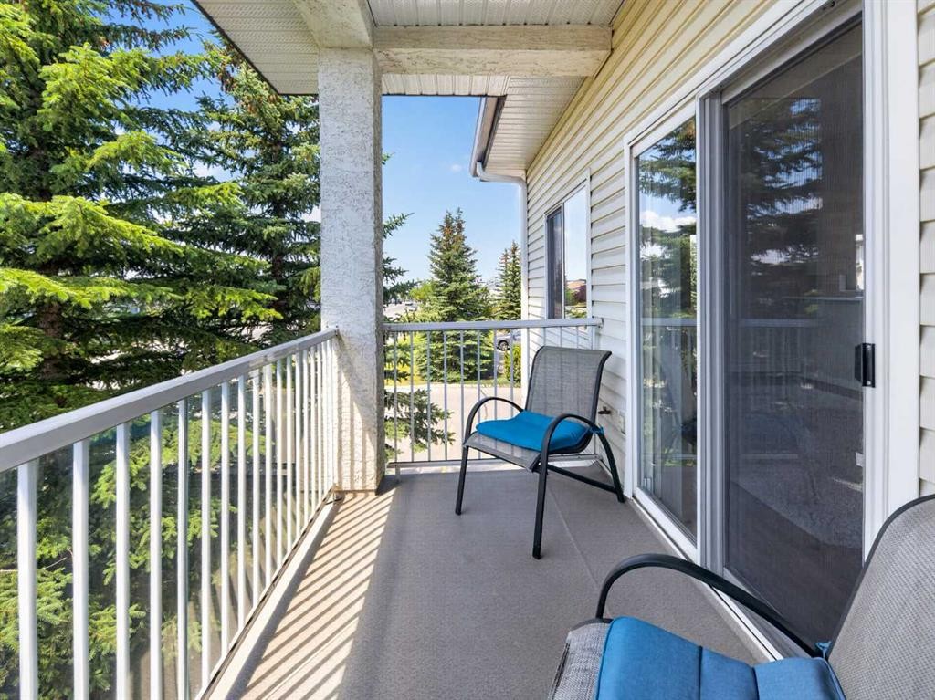 201-72 Quigley Drive, Cochrane, AB - Outdoor With Balcony With Exterior