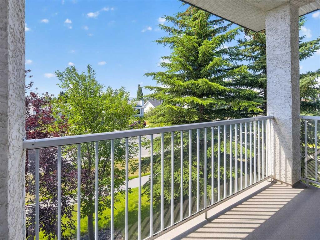 201-72 Quigley Drive, Cochrane, AB - Outdoor With Balcony