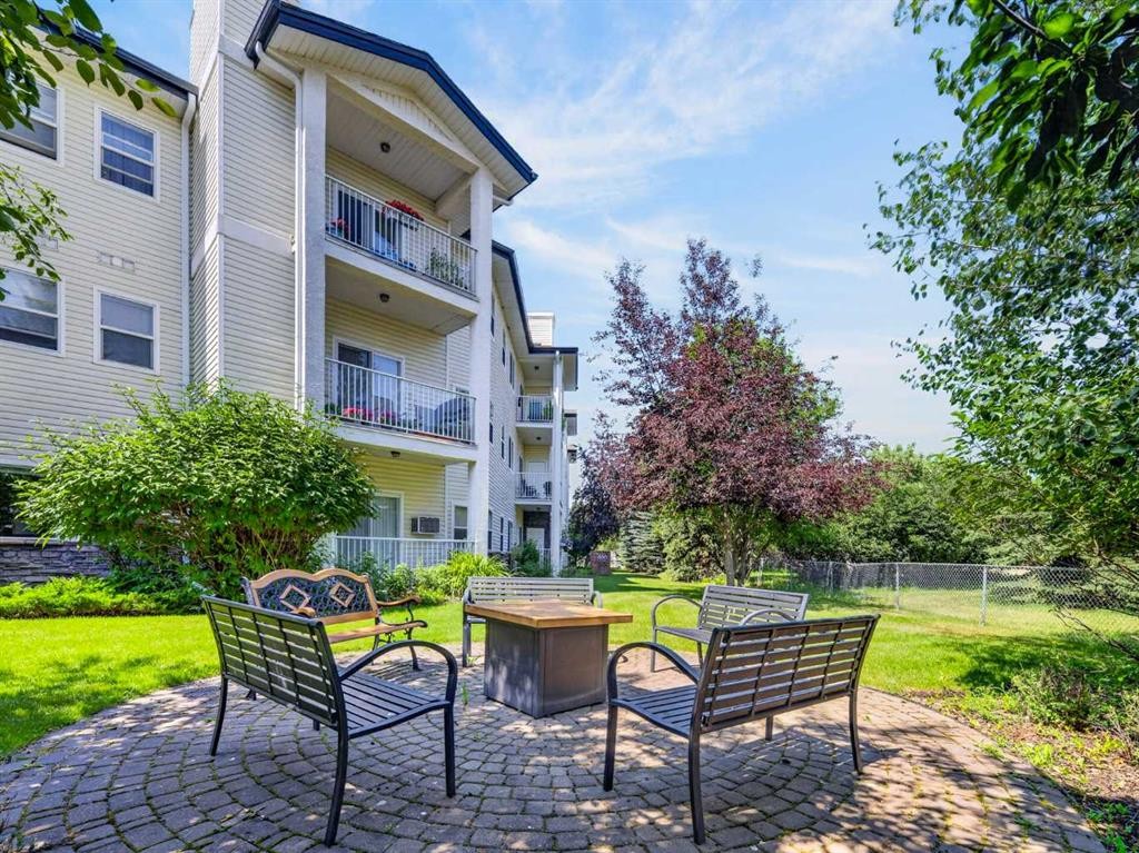 201-72 Quigley Drive, Cochrane, AB - Outdoor With Balcony
