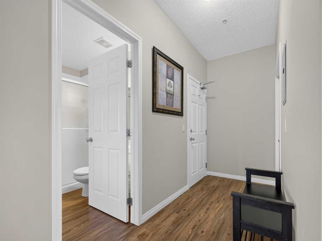 201-72 Quigley Drive, Cochrane, AB - Indoor Photo Showing Other Room
