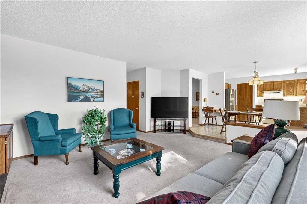105 Christie Knoll Heights Sw, Calgary, AB - Indoor Photo Showing Living Room