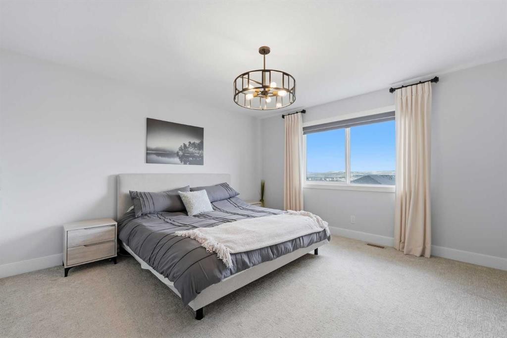 411 Rivercrest Boulevard, Cochrane, AB - Indoor Photo Showing Bedroom
