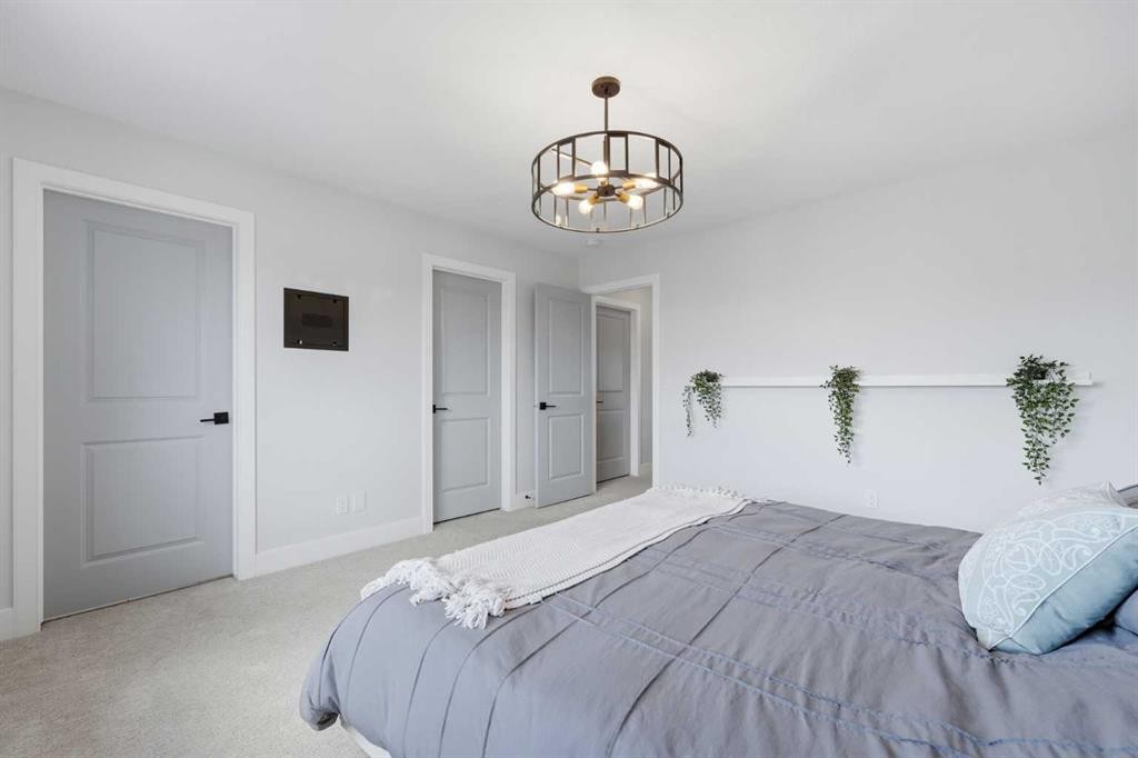 411 Rivercrest Boulevard, Cochrane, AB - Indoor Photo Showing Bedroom