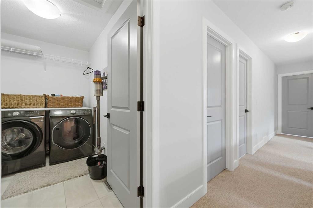 411 Rivercrest Boulevard, Cochrane, AB - Indoor Photo Showing Laundry Room
