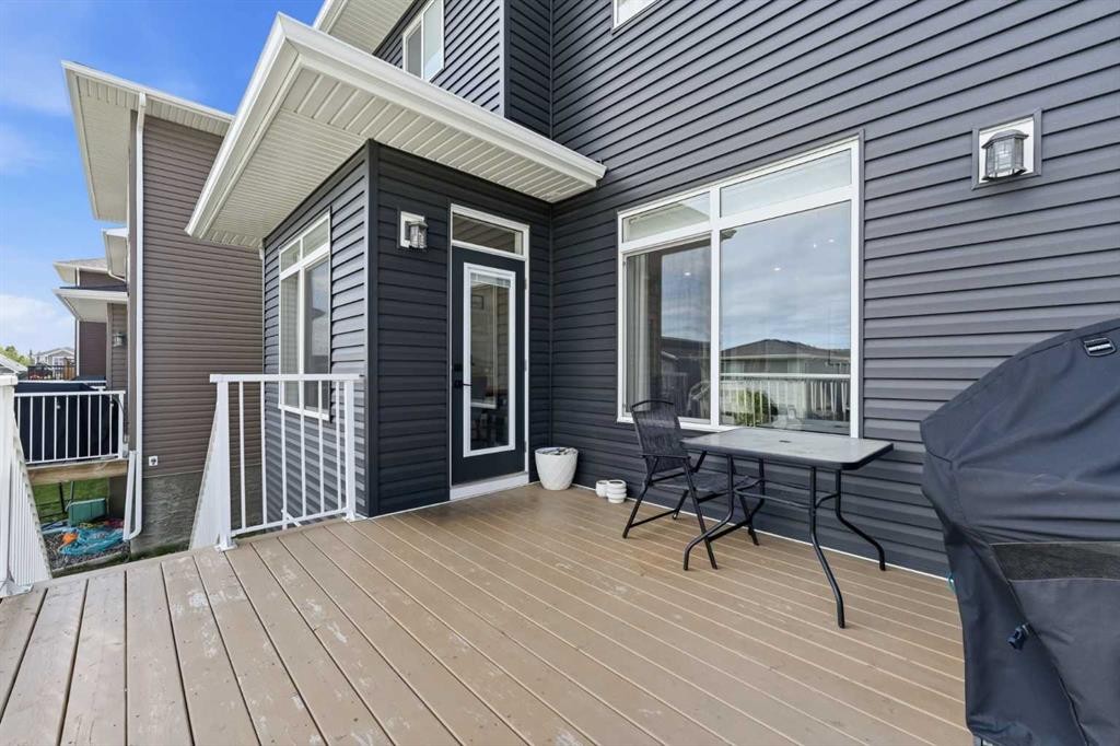 411 Rivercrest Boulevard, Cochrane, AB - Outdoor With Deck Patio Veranda With Exterior